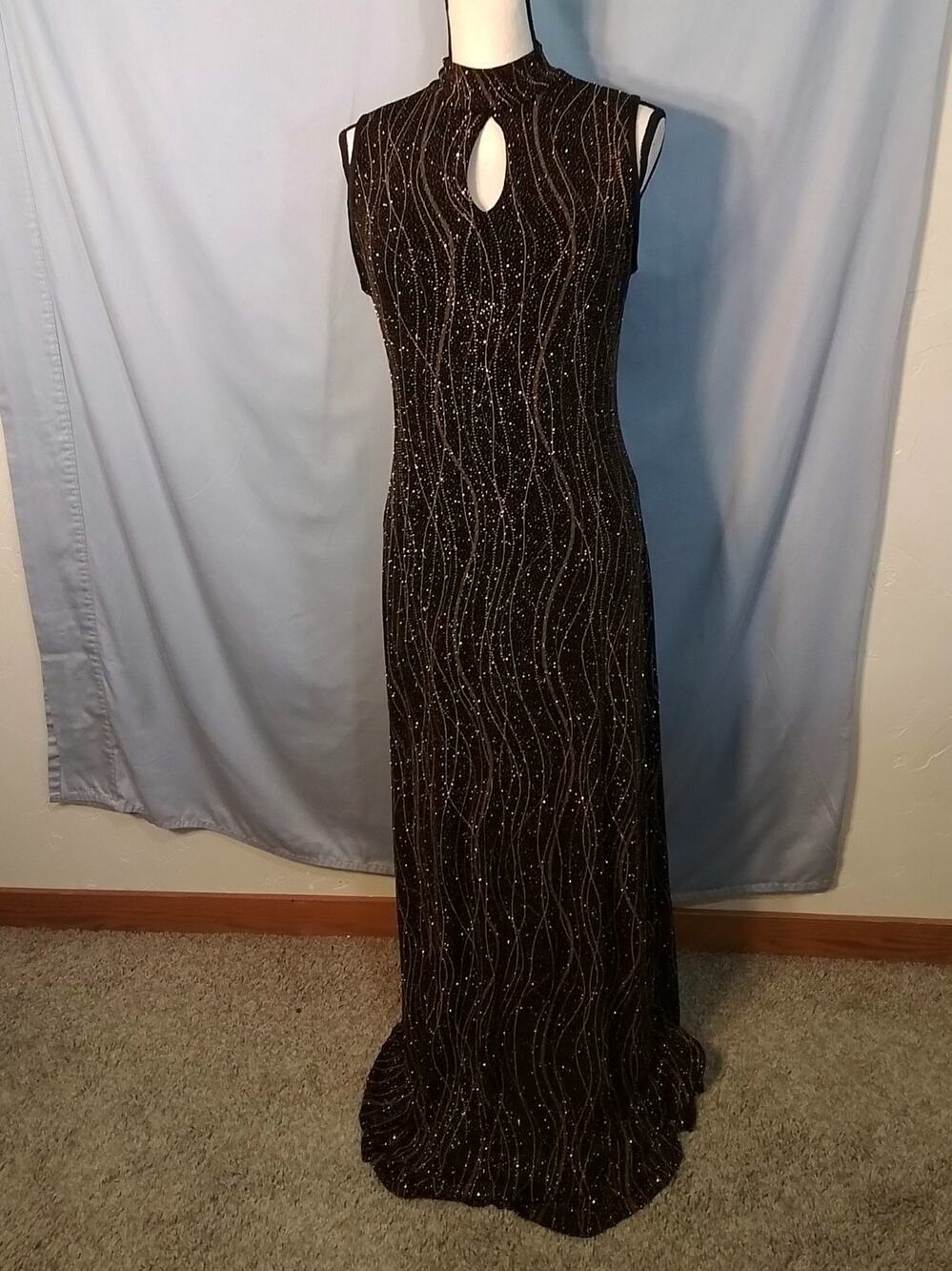 (Ronni Nicole ?) , Black dress with gold sequins